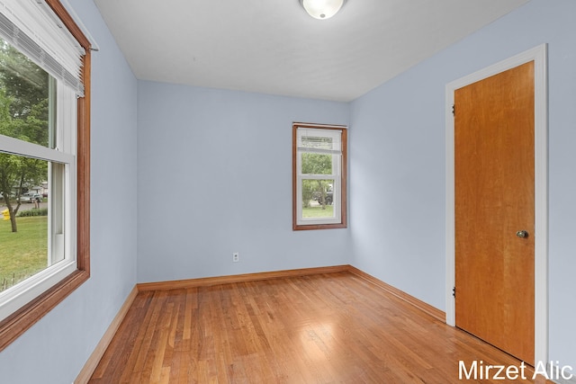1145 Eastmont Dr SE, Grand Rapids, MI 49546 - unfurnished room with wood finished floors and baseboards