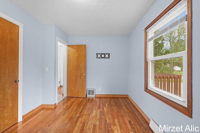 1145 Eastmont Dr SE, Grand Rapids, MI 49546 - unfurnished bedroom with light wood-style floors and baseboards