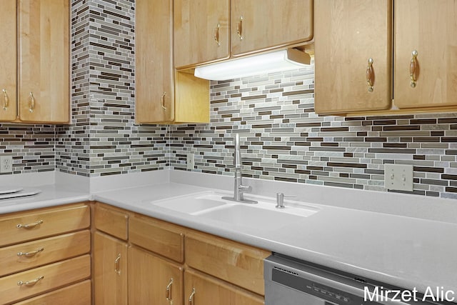 1145 Eastmont Dr SE, Grand Rapids, MI 49546 - kitchen with a sink, backsplash, light countertops, dishwasher, and light brown cabinetry