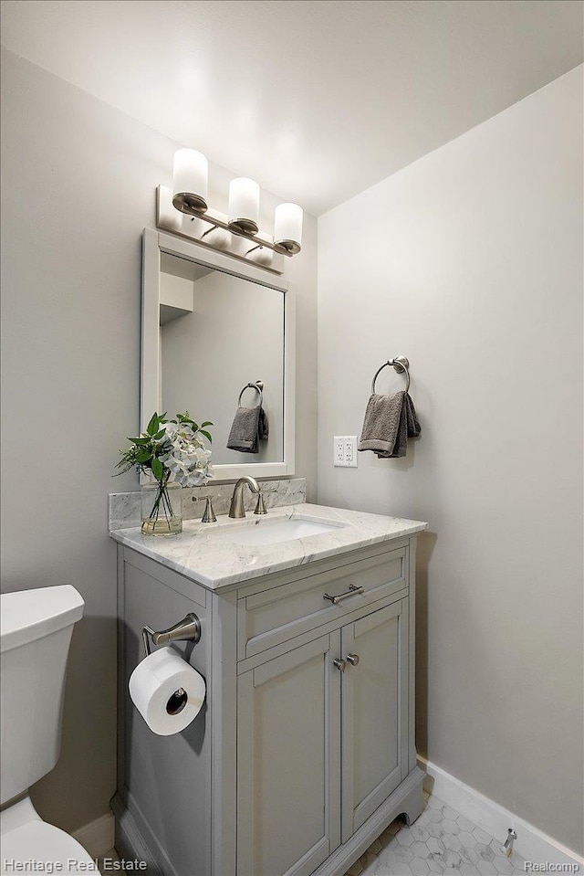 2376 Bacon Ave, Berkley, MI 48072 - bathroom with baseboards, vanity, and toilet
