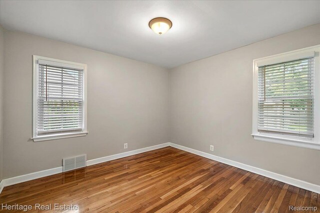2376 Bacon Ave, Berkley, MI 48072 - empty room with baseboards and wood-type flooring