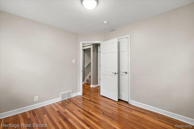 2376 Bacon Ave, Berkley, MI 48072 - unfurnished bedroom with baseboards, wood finished floors, and a closet