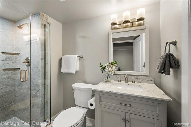2376 Bacon Ave, Berkley, MI 48072 - bathroom featuring toilet, vanity, and a stall shower