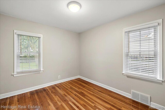 2376 Bacon Ave, Berkley, MI 48072 - spare room featuring baseboards and wood finished floors