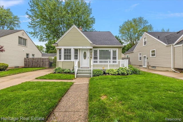 2376 Bacon Ave, Berkley, MI 48072 - view of front of home with a chimney and roof with shingles