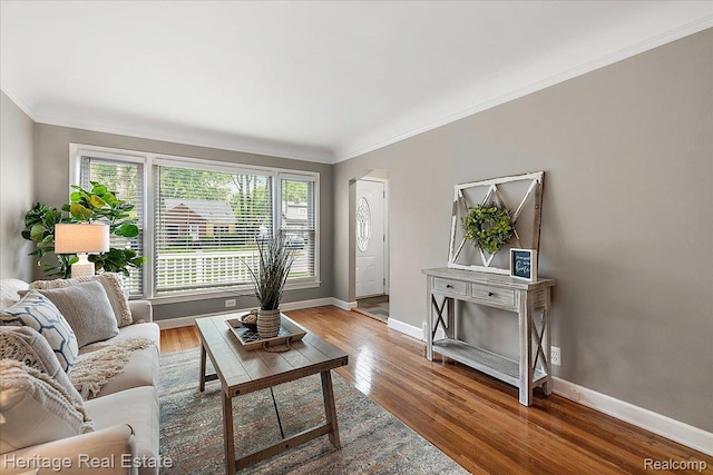 2376 Bacon Ave, Berkley, MI 48072 - living area with ornamental molding, baseboards, and wood finished floors