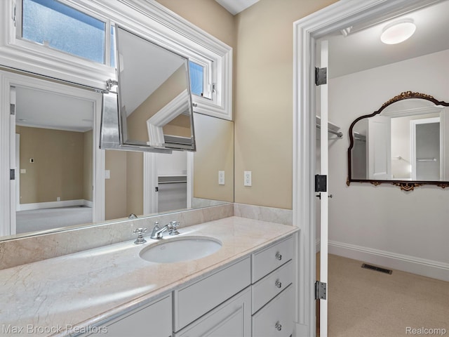 2921 Turtle Pond Ct, Bloomfield Hills, MI 48302 - bathroom with vanity, healthy amount of natural light, and baseboards