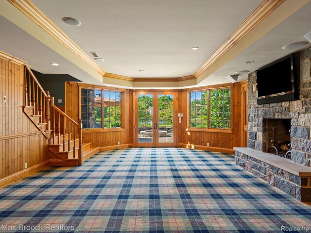 2921 Turtle Pond Ct, Bloomfield Hills, MI 48302 - carpeted entryway featuring stairway, baseboards, a stone fireplace, ornamental molding, and wooden walls