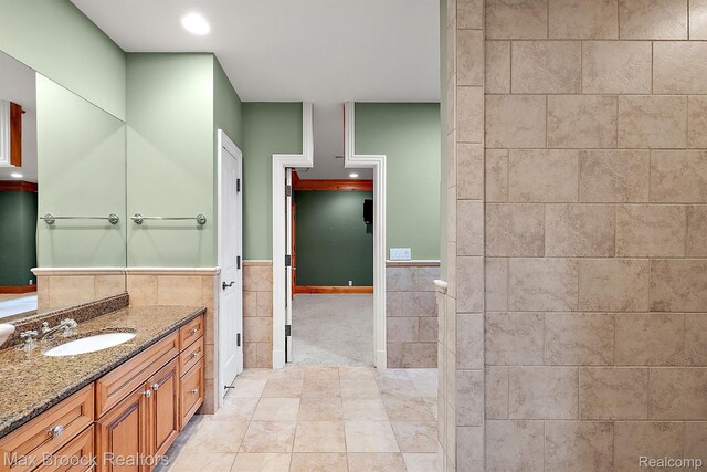 2921 Turtle Pond Ct, Bloomfield Hills, MI 48302 - bathroom featuring vanity, tile walls, recessed lighting, a shower, and tile patterned floors