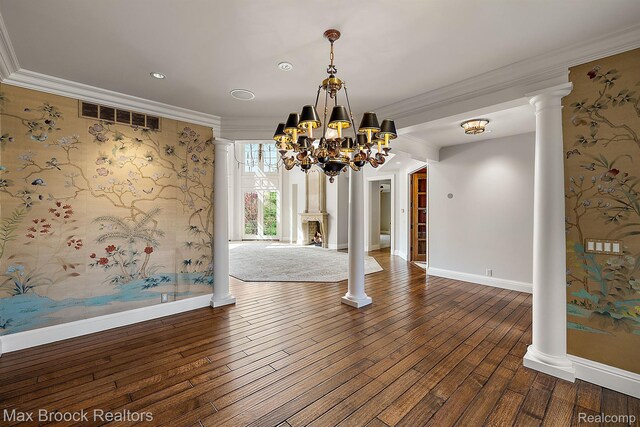 2921 Turtle Pond Ct, Bloomfield Hills, MI 48302 - unfurnished dining area featuring a chandelier, baseboards, hardwood / wood-style flooring, crown molding, and ornate columns