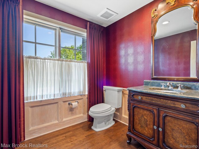2921 Turtle Pond Ct, Bloomfield Hills, MI 48302 - half bathroom featuring wood finished floors, toilet, and vanity
