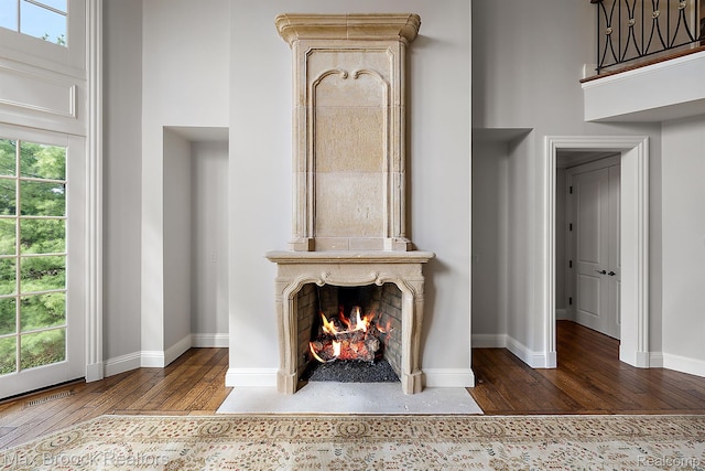 2921 Turtle Pond Ct, Bloomfield Hills, MI 48302 - detailed view of wood finished floors, a fireplace, and baseboards