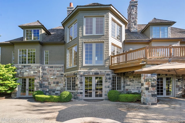 2921 Turtle Pond Ct, Bloomfield Hills, MI 48302 - rear view of property with french doors and a chimney