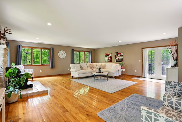 5960 Kidder Rd, Almont, MI 48003 - living area featuring plenty of natural light, light wood-style flooring, baseboards, recessed lighting, and french doors