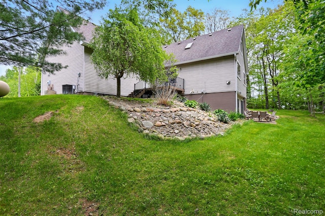 5960 Kidder Rd, Almont, MI 48003 - rear view of property with a yard, roof with shingles, central air condition unit, and a patio area