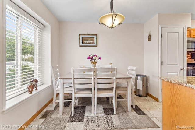 4328 15 Mile Rd, Sterling Heights, MI 48310 - dining room with baseboards and light tile patterned floors