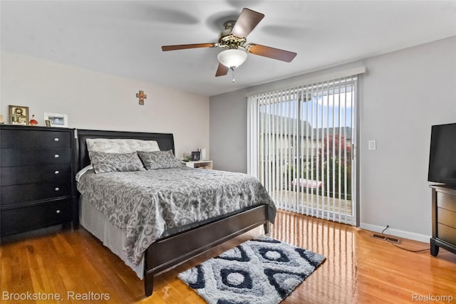 4328 15 Mile Rd, Sterling Heights, MI 48310 - bedroom featuring wood finished floors, baseboards, access to outside, and ceiling fan