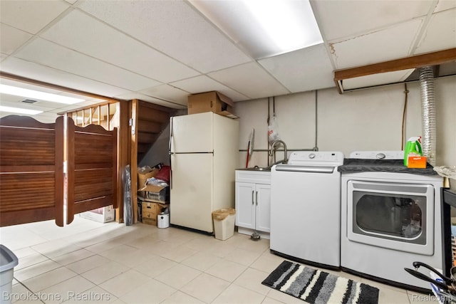 4328 15 Mile Rd, Sterling Heights, MI 48310 - laundry area with washer and clothes dryer and cabinet space