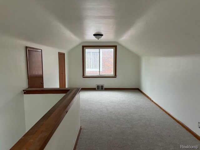 13801 Fordham St, Detroit, MI 48205 - bonus room with carpet floors, vaulted ceiling, and baseboards