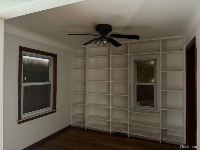 13801 Fordham St, Detroit, MI 48205 - empty room with dark wood-style floors, a ceiling fan, and baseboards