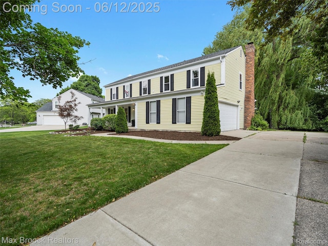 5544 Kingsfield Dr, West Bloomfield, MI 48322 - view of front of property featuring a chimney, concrete driveway, a front lawn, and a garage