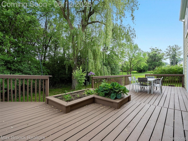 5544 Kingsfield Dr, West Bloomfield, MI 48322 - wooden deck featuring outdoor dining space and view of wooded area