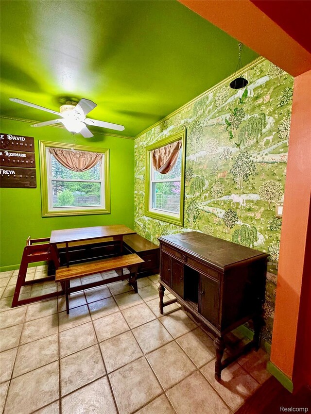 219 W Butler St, Bad Axe, MI 48413 - tiled dining room with wallpapered walls and ceiling fan