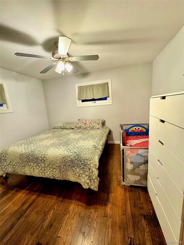 219 W Butler St, Bad Axe, MI 48413 - bedroom with dark wood finished floors and a ceiling fan