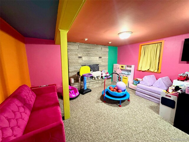 219 W Butler St, Bad Axe, MI 48413 - game room featuring carpet and a fireplace