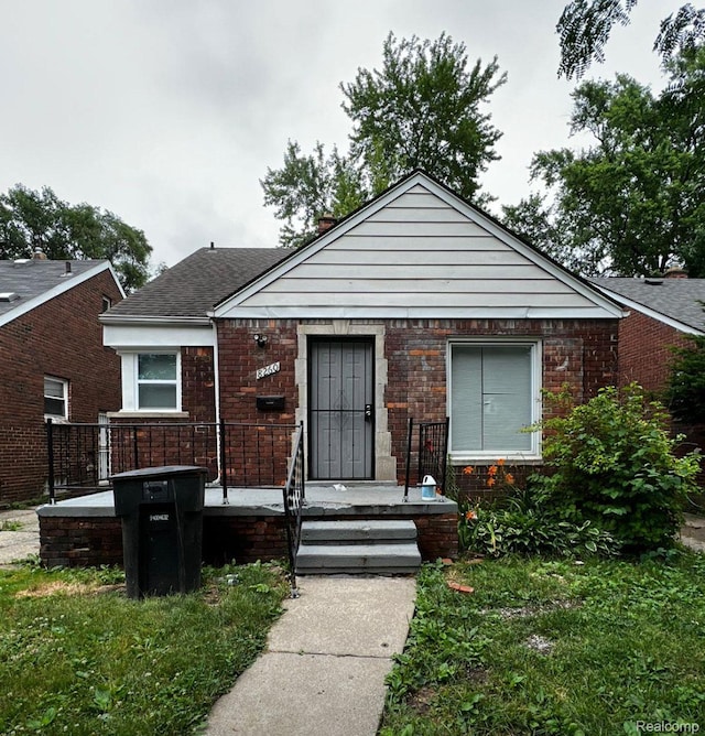 8260 Coyle St, Detroit, MI 48228 - bungalow with brick siding and roof with shingles