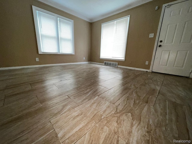 8260 Coyle St, Detroit, MI 48228 - empty room with plenty of natural light, baseboards, and crown molding