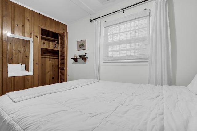 5810 N Lakeshore Rd, Deckerville, MI 48427 - bedroom with wooden walls and a closet