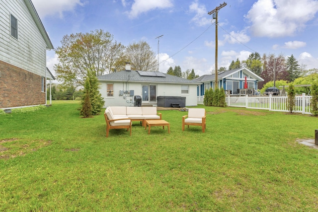 5810 N Lakeshore Rd, Deckerville, MI 48427 - rear view of property featuring roof mounted solar panels, an outdoor hangout area, and a chimney