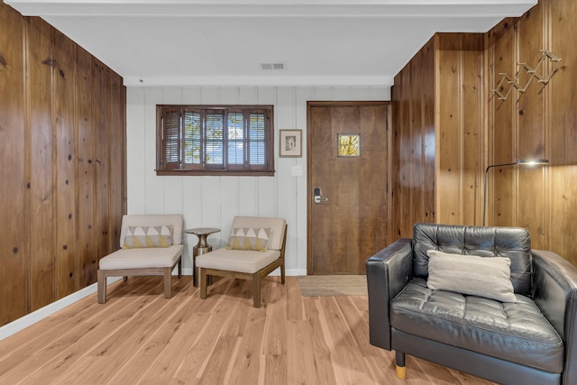 5810 N Lakeshore Rd, Deckerville, MI 48427 - living area with light wood finished floors, wood walls, and baseboards
