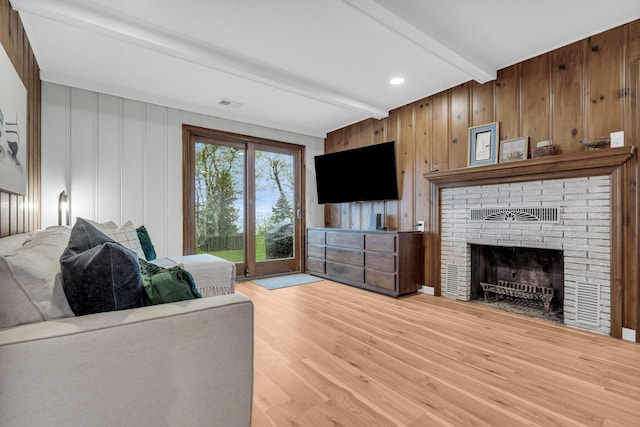5810 N Lakeshore Rd, Deckerville, MI 48427 - living room with beamed ceiling, light wood finished floors, and a fireplace
