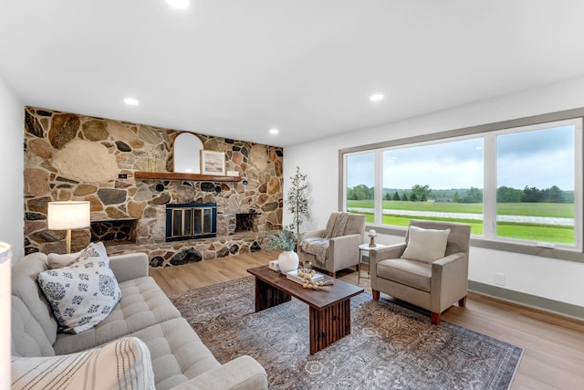 5853 W 112th St, Grant, MI 49327 - living area with wood finished floors, a fireplace, and recessed lighting