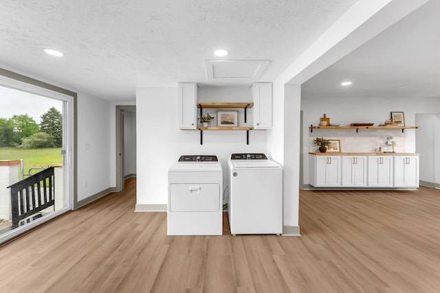 5853 W 112th St, Grant, MI 49327 - laundry area with washer and clothes dryer, light wood-style flooring, baseboards, a textured ceiling, and recessed lighting