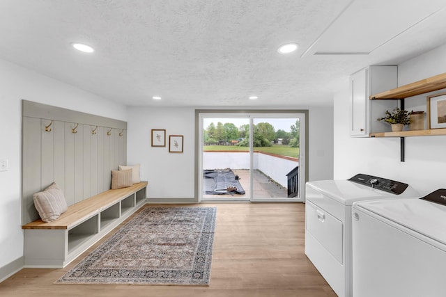5853 W 112th St, Grant, MI 49327 - laundry area featuring washing machine and dryer, recessed lighting, light wood finished floors, a textured ceiling, and baseboards