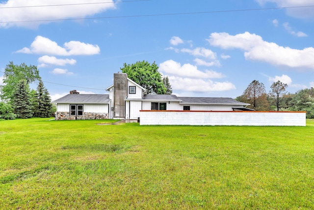5853 W 112th St, Grant, MI 49327 - back of property with a yard and a chimney