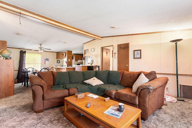 1211 107th Ave, Otsego, MI 49078 - living area featuring carpet flooring, a textured ceiling, a ceiling fan, and crown molding
