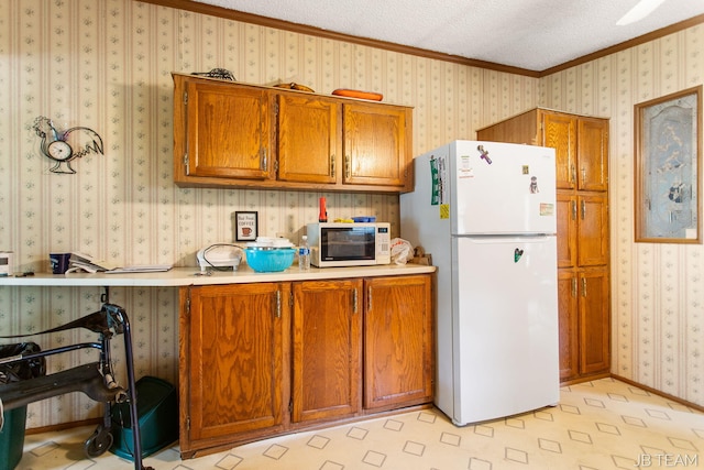 1211 107th Ave, Otsego, MI 49078 - kitchen with white appliances, brown cabinetry, crown molding, light countertops, and wallpapered walls