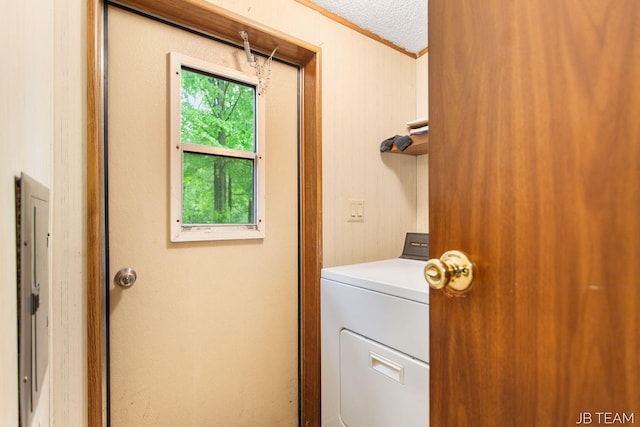 1211 107th Ave, Otsego, MI 49078 - laundry room with washer / dryer, ornamental molding, and a textured ceiling