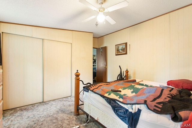 1211 107th Ave, Otsego, MI 49078 - bedroom with carpet, a closet, ceiling fan, ornamental molding, and wood walls