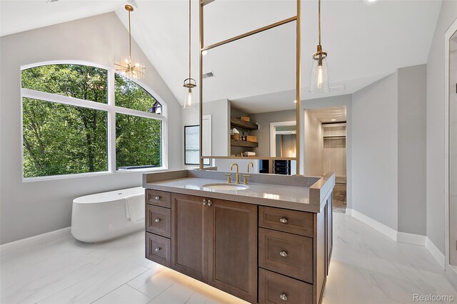 3268 Willis Dr, Oakland, MI 48306 - bathroom featuring a freestanding bath, vanity, baseboards, lofted ceiling, and marble finish floors