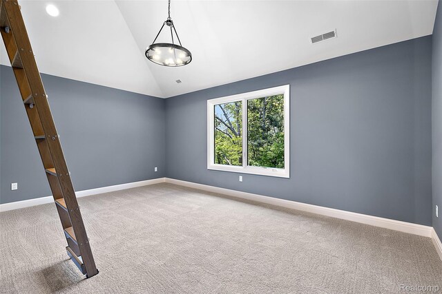 3268 Willis Dr, Oakland, MI 48306 - spare room with vaulted ceiling, carpet flooring, and baseboards