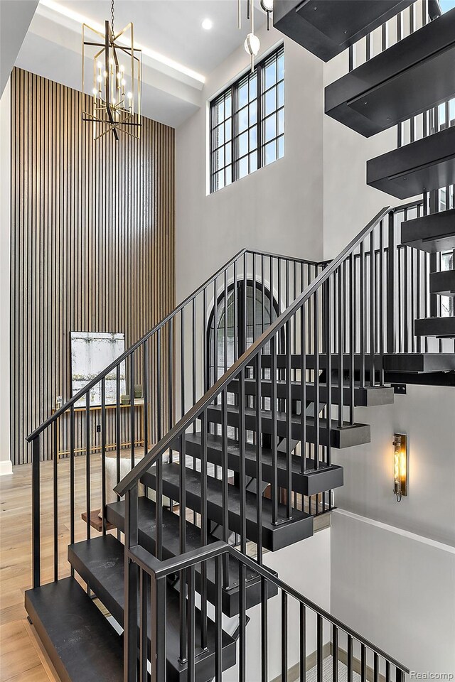 3268 Willis Dr, Oakland, MI 48306 - staircase with a high ceiling, wood finished floors, a chandelier, and recessed lighting