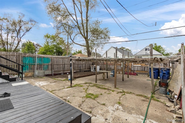 5151 Yemans St, Hamtramck, MI 48212 - fenced backyard with a wooden deck and a patio area