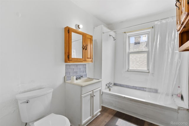5151 Yemans St, Hamtramck, MI 48212 - bathroom featuring vanity, shower / bath combo with shower curtain, toilet, and wood finished floors