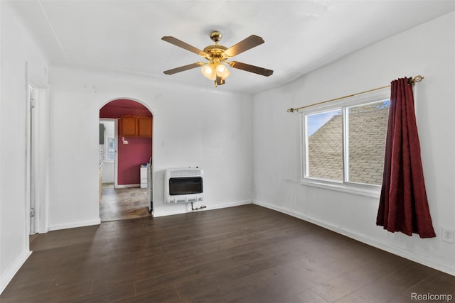 5151 Yemans St, Hamtramck, MI 48212 - unfurnished room featuring heating unit, arched walkways, ceiling fan, and wood finished floors