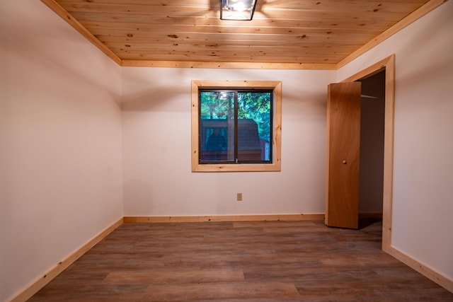 17341 Old Logging Rd, Hersey, MI 49639 - unfurnished bedroom with wood ceiling, wood finished floors, and baseboards